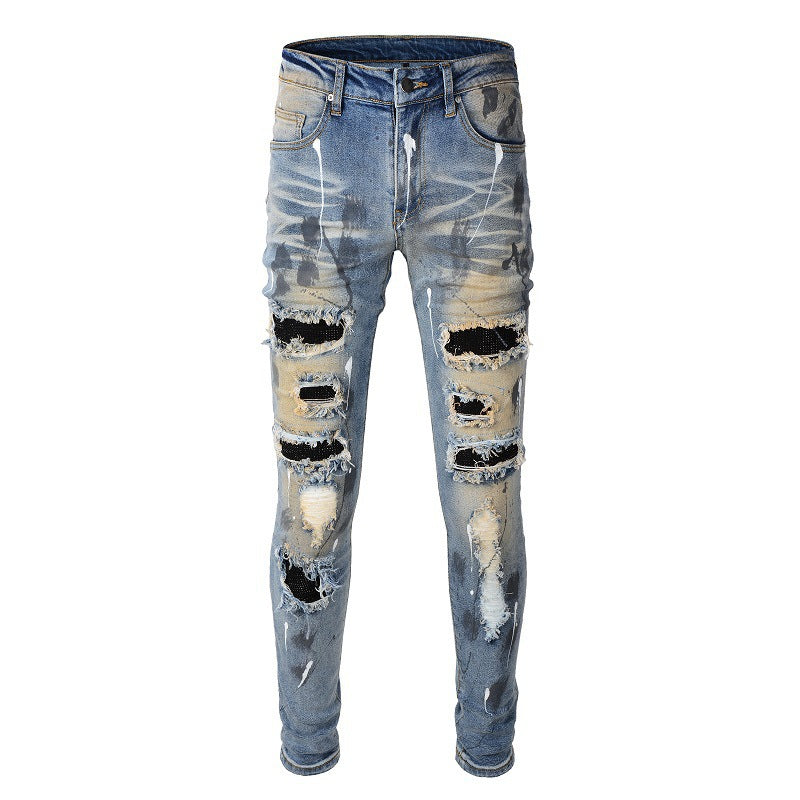 Men's Blue Jeans with Black Patches, Distressed Paint, and Ripped Details