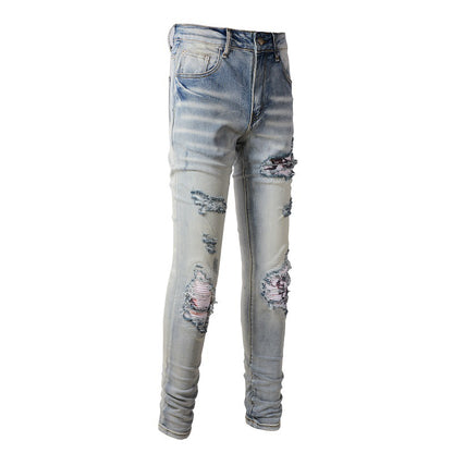 Jean déchiré Street Tide européen et américain épuisé Pantalon slim High Street Tide en denim